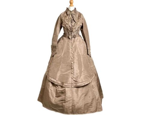 A Victorian four-piece chocolate silk day dress, comprising; button-down bodice, full skirt, button-down and cusped over-skir