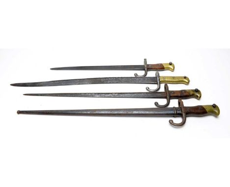 A French 19th Century Chassepot rifle sword bayonet, with brass grip and hook quillon, 70cms long; and three Gras rifle bayon