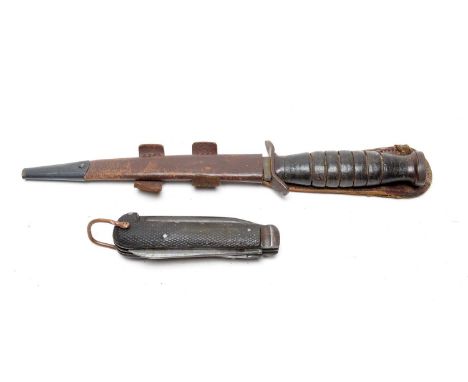 A US Second World War Mk3 trench knife, the 16cms blade with leather grip and fitted an unoriginal Commando scabbard; and a N