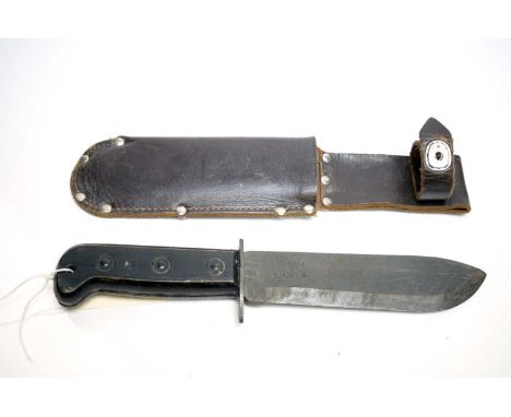 A British Army survival knife, 1987, the 18cms blade numbered 127-8214, dated and with broad arrow mark, in belt mounting she
