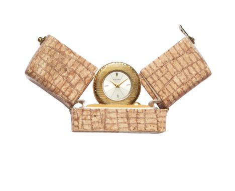 REUGE WATCH WITH MUSIC BOX, 70s - REUGE WATCH WITH MUSIC BOX, 70S Case: brass with lining texture, cylindrical feet. Dial: si