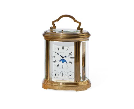 CARRIAGE CLOCK WITH CHIME AND CALENDAR, CIRCA 1980 - CARRIAGE CLOCK WITH CHIME AND CALENDAR, CIRCA 1980 Case: oval molded bra