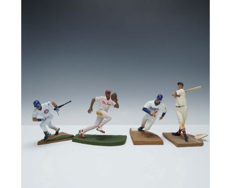 A collection of four McFarlane Major League Baseball action figures featuring iconic players in classic uniforms. Includes Sa