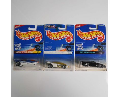 Collection of twelve Mattel Hot Wheels die-cast metal toy cars, each in original packaging from various themed series. The as