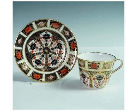 A fine Royal Crown Derby porcelain teacup and saucer in the iconic Old Imari pattern 1128. This richly decorated set features