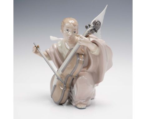 Lladro's Heavenly Cellist (#01005492), sculpted by Fulgencio Garcia, depicts a serene angel in mid-performance, tenderly play