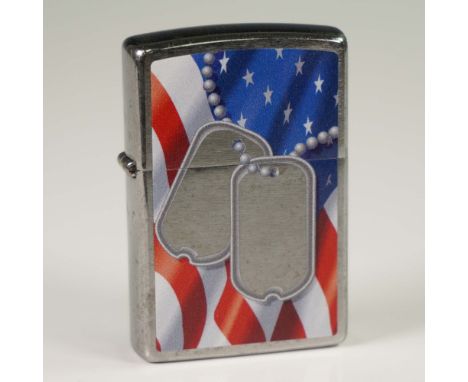 Produced by Zippo Manufacturing Company, this silver-metal lighter features a design showcasing a pair of dog tags against an
