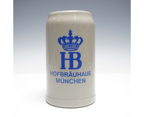 Classic German stoneware beer stein featuring the blue Hofbrauhaus Munchen logo with crowned HB monogram on the front. Produc
