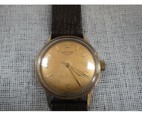 LONGINES: A gentleman's wristwatch, the dial with baton and Arabic numerals, sweep seconds hand, inscribed 'Longines', attach