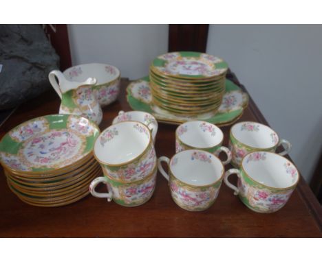 AN EARLY 20TH CENTURY MINTON PART TEA SERVICE decorated with exotic birds