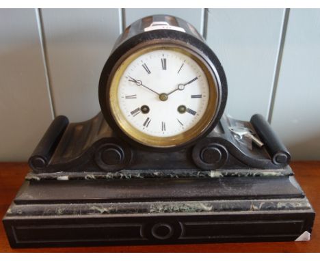 A 19TH CENTURY BLACK SLATE MANTEL CLOCK of barrel form with broad scrolling base, the French movement with countwheel strike 