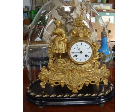 A FRENCH GILT METAL MANTEL CLOCK, two train, count wheel movement signed 'E Pannard', the case with a lady carrying a rake an