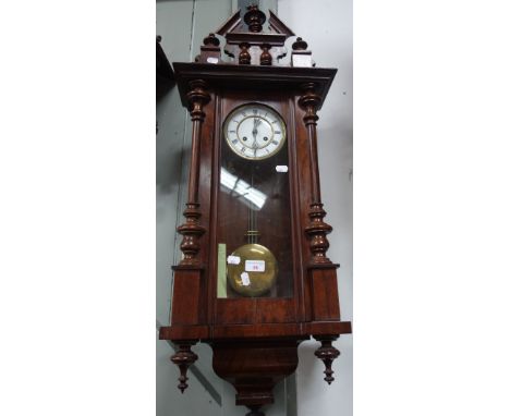 A WALNUT CASED VIENNA STYLE WALL CLOCK