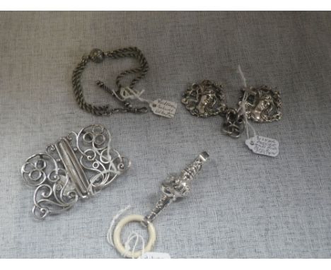 A SILVER ART NOUVEAU CLOAK FASTENER, a silver belt-buckle, silver babies rattle and an albertina (c.2.2oz) (4)