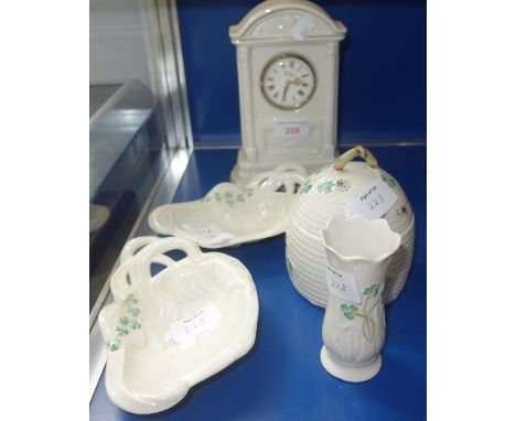 BELLEEK; A COLLECTION OF CERAMICS decorated with shamrocks, to include a clock and a honey pot