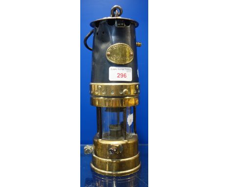A 19TH CENTURY BRASS AND IRON MINER'S LAMP, by 'Petterson Lamps Ltd'