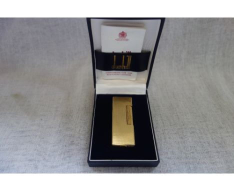 A DUNHILL GOLD PLATED LIGHTER in a fitted box