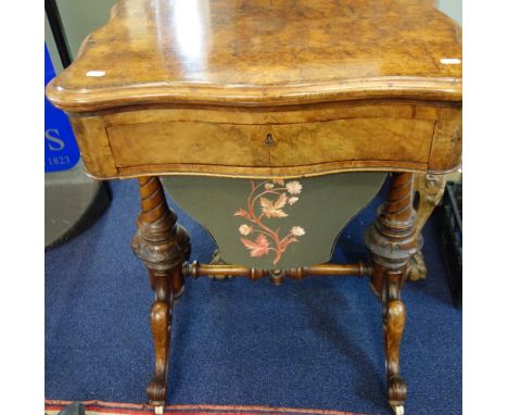 A VICTORIAN FIGURED WALNUT WORK TABLE, with fold open chess board and backgammon board, 60cm wide