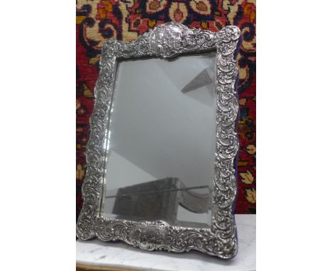 A silver effect easel back mirror - 48cm H x 32cm W 