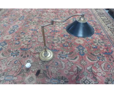A modern brass effect reading lamp 