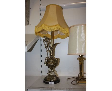 Two Brass Lamps, one having column base with cream shade, the other being a brass ewer made converted into electric lamp 