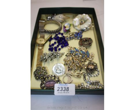 A quantity of Costume jewellery Brooches, Bangles, Necklaces and a Ladies Timex Wristwatch.