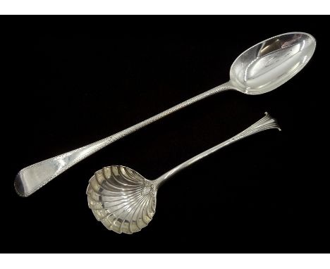 George III silver basting spoon, bright cut feather edging by Richard Crossley, London 1790 and a George III silver sauce lad