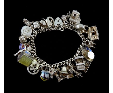 Silver charm bracelet, charms including puppet show, dancers, poodle, camera, ballerina inside a swan, all stamped or tested,