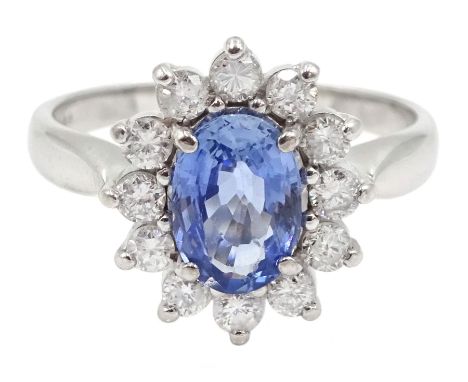 18ct white gold oval sapphire and round brilliant cut diamond cluster ring, Birmingham 2004Click here to view further images,