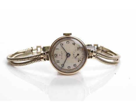 LADY'S EARLY TWENTIETH CENTURY NINE CARAT GOLD ROLEX COCKTAIL WATCH
signed fifteen jewels manual wind Rolex Prima movement, t
