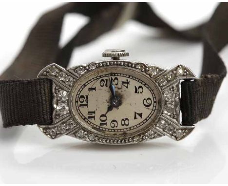 LADY'S EARLY TWENTIETH CENTURY PLATINUM AND DIAMOND COCKTAIL WATCH
unsigned manual wind movement, the silvered dial with Arab