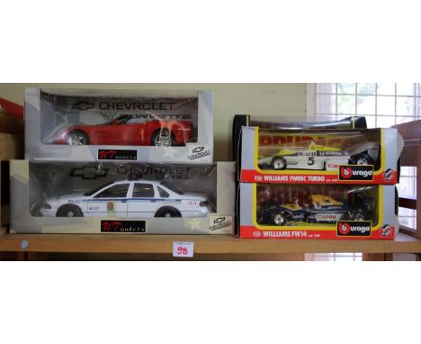 Four boxed Burago models, to include a Jaguar XK120 Roadster; together with two boxed UT Models, scale 1:18. (6)