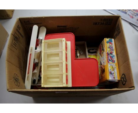 A mixed box of toys, to include a Corgi Juniors multi-garage; a Corgi 'The Wizard' 98758, boxed; a small quantity of plastic 