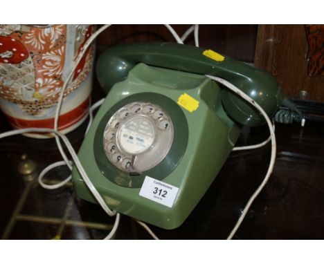 A VINTAGE GREEN TELEPHONE