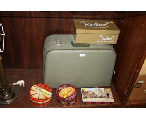 A CASED VINTAGE SEWING MACHINE AND TINS OF BUTTONS ETC