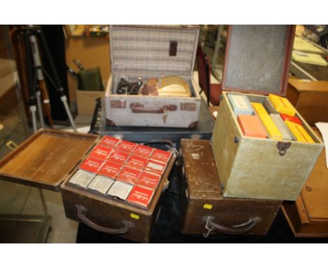 A CASED PAXIMAT PROJECTOR TOGETHER WITH A LARGE COLLECTION OF SLIDES FROM 1960'S ETC CONTAINED IN FOUR CASES