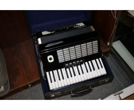 A CASED WELTMEISTER STELLA ACCORDION