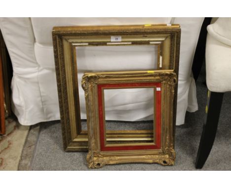 A VINTAGE GILT PICTURE FRAME TOGETHER WITH A SMALLER EXAMPLE