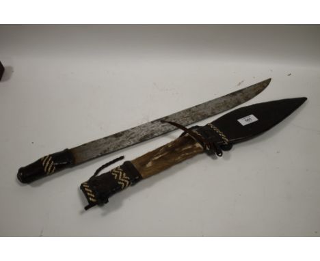 A VINTAGE TRIBAL STYLE KNIFE IN LEATHER SHEATH 