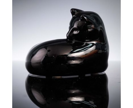 This Baccarat crystal figurine features a sleek black cat stretching gracefully as it turns to groom its back, captured in lu