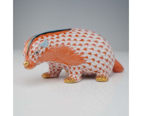 Cute porcelain figurine depicting a stylized badger, hand painted in the classic rust fishnet pattern with gilt trim accents 