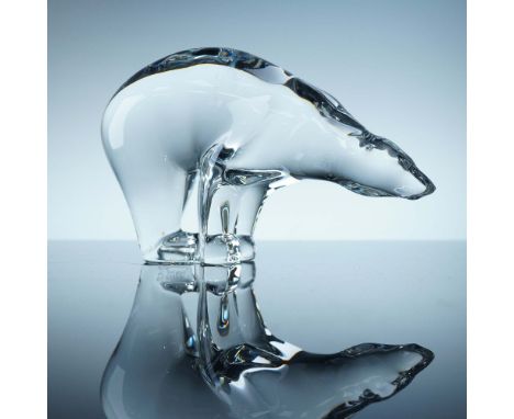 Sleek and minimalist crystal polar bear figurine by Baccarat, crafted in clear crystal with graceful curves and stylized feat