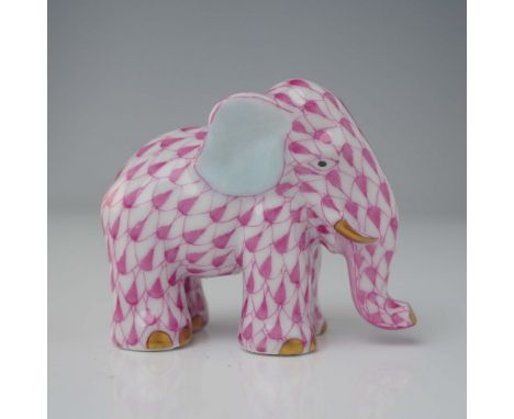 Ravishing porcelain figurine hand painted with delicate pink fishnet pattern, and gilt accents. Herend backstamp. Dimensions: