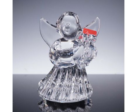 Graceful Baccarat crystal figurine featuring an angel in a flowing gown, gently playing a harp. This hand-crafted piece showc