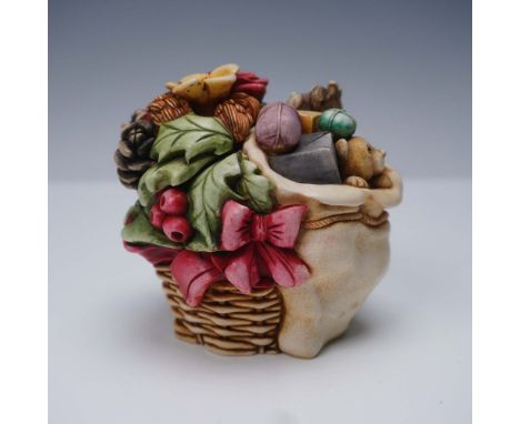 A Harmony Kingdom box figurine titled Winter Bouquet from the Harmony Garden collection. Released in 2000, this limited editi