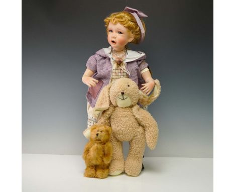 This Seymour Mann porcelain doll from the Signature Series Collection is named Brittany and stands 25 inches tall. Crafted wi