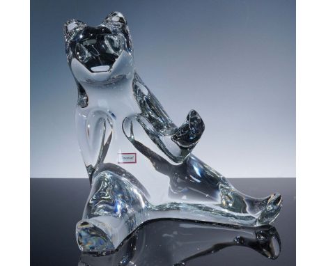 Charming seated bear figurine by Baccarat, crafted in luminous clear crystal with a smooth, contemporary silhouette. The bear
