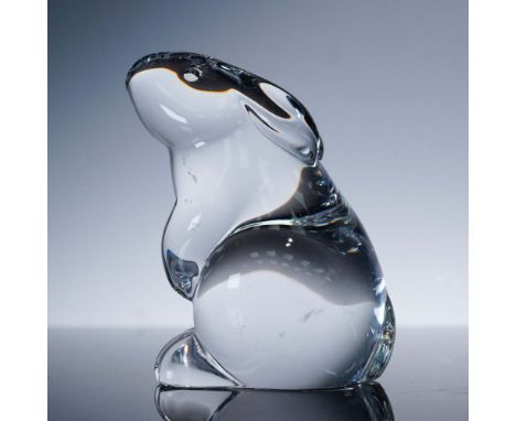 This clear Baccarat crystal figurine captures the serene form of a rabbit sitting upright, featuring softly rounded contours 