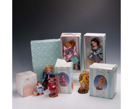 This charming 6-piece collection of Madame Alexander figurines includes a delightful mix of porcelain and vinyl dolls, each w
