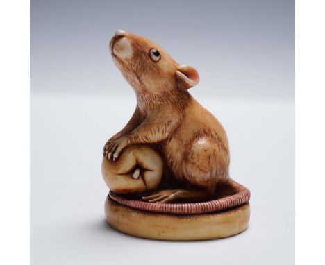 This delightful Harmony Kingdom figurine titled Finky features a wide-eyed mouse tenderly holding a round fruit. Sculpted wit